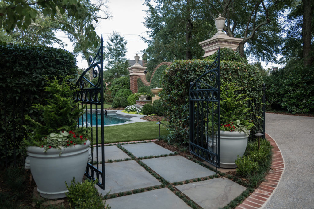 Dual Swing Garden Gates leading to a Luxury Garden