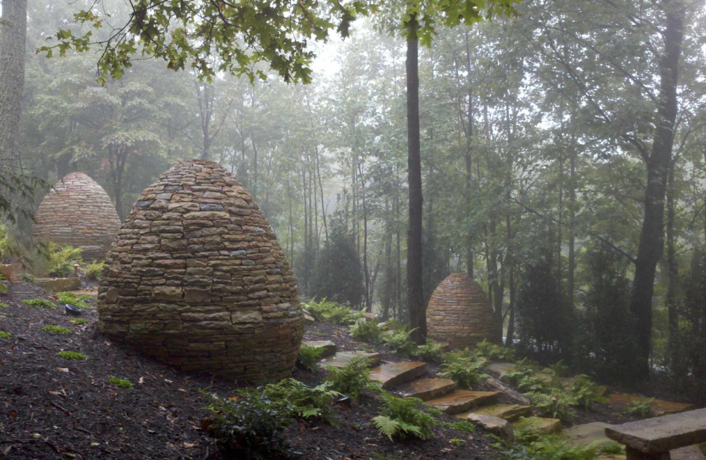 Commercial Landscape Architecture - Three Stone Sculptures by staircase